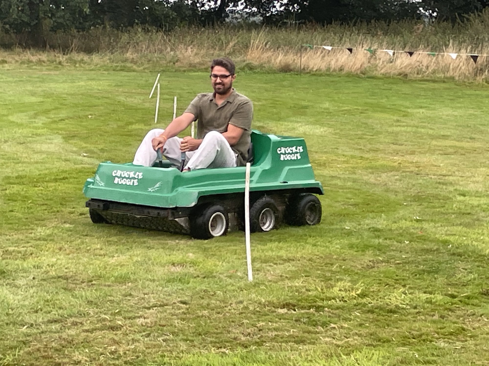 A driver spinning a six-wheel-drive Chuckle Buggy on a course